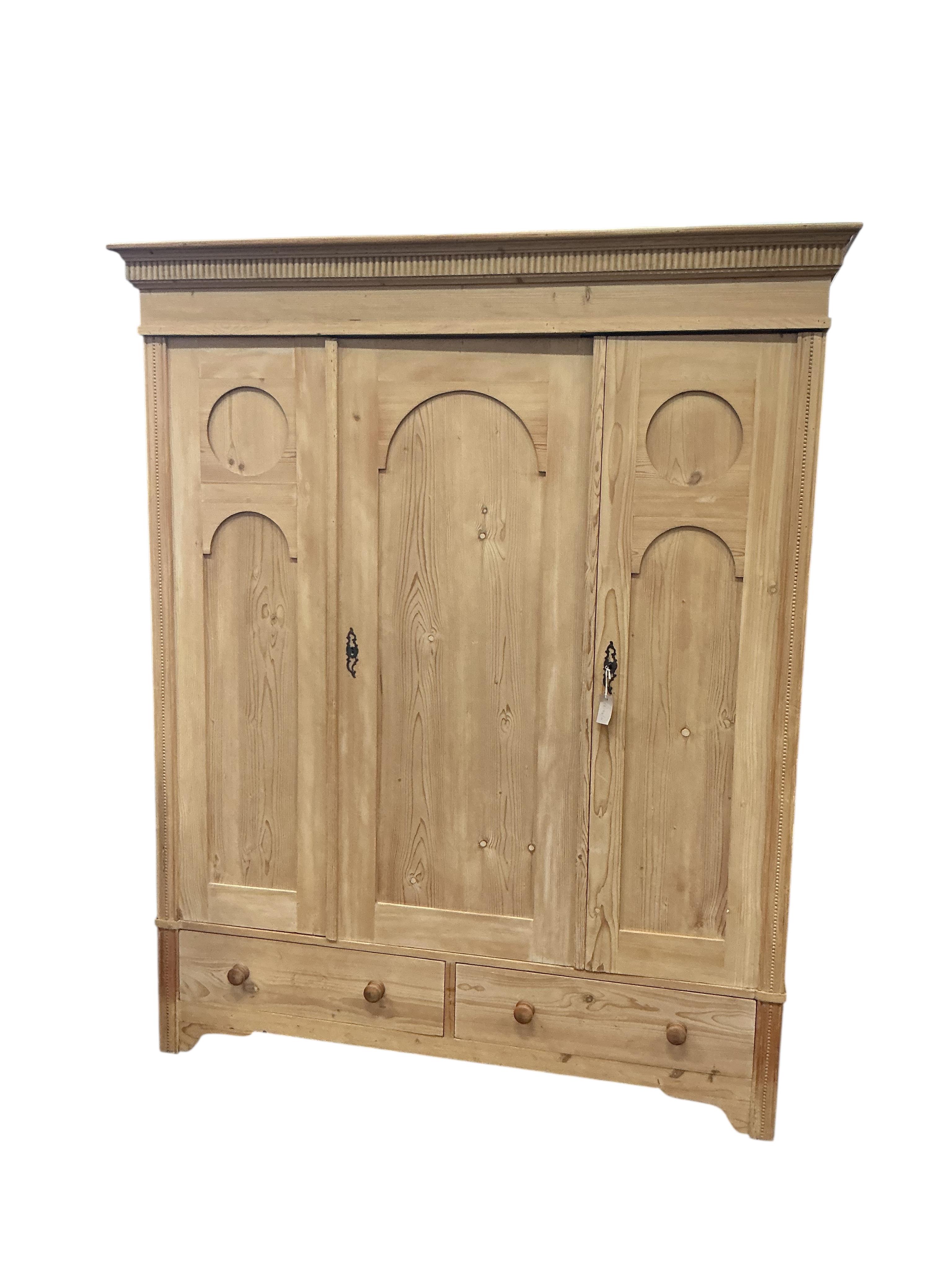 A 19th century Continental pine 'knockdown' triple wardrobe, width 170cm, depth 64cm, height 209cm